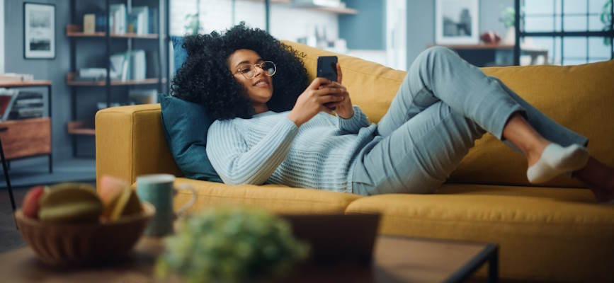 -person enjoying trusted news more than AI misinformation -