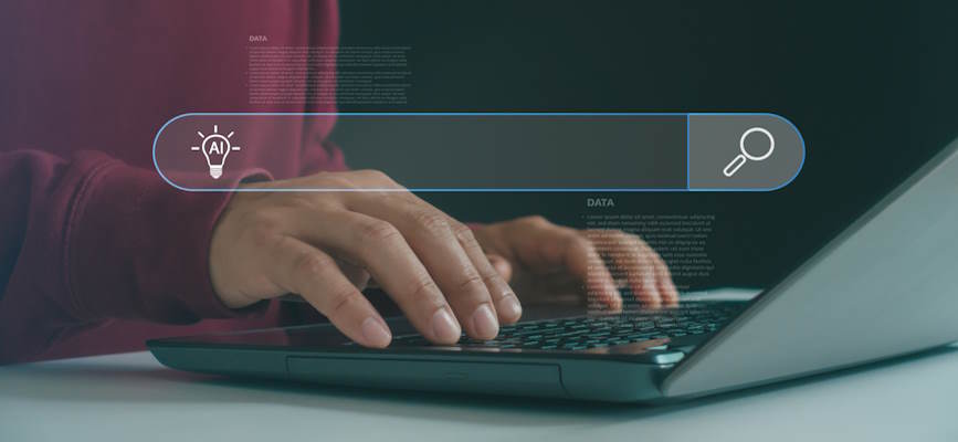 -hands typing on keyboard showing AI search-
