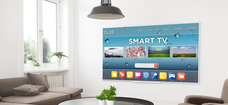 A smart TV on the wall of a home to suggest the topic of the article: CTV opportunities for media companies and audiences