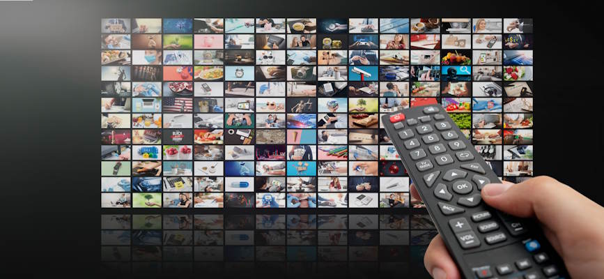 -remote control in front of a screen with copious video offerings to show the difficulty of streaming differentiation-