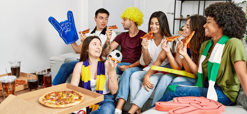 -fandom group of fans in living room-