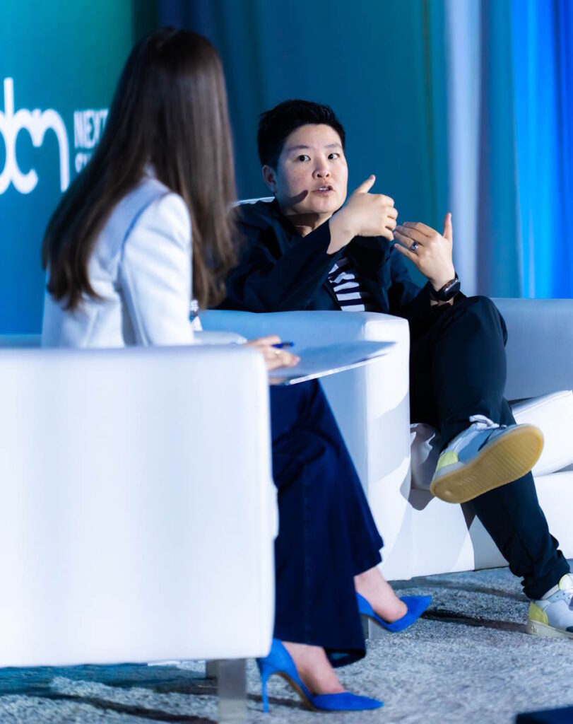 -Jen Wong COO of Reddit being interviewed by Axios' Sara Fischer at the 2026 DCN Summit-