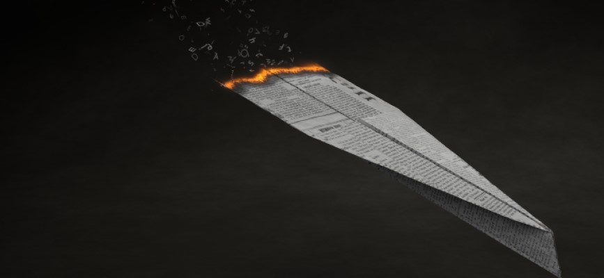 Newspaper plane on fire