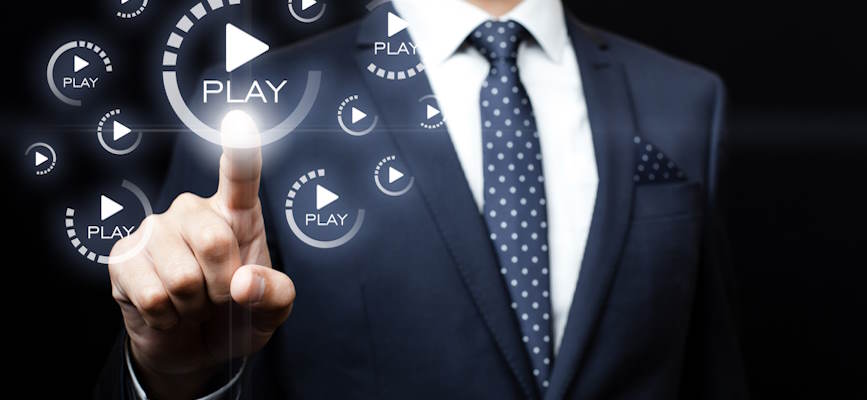 -exec pressing play button to represent the streaming video business-