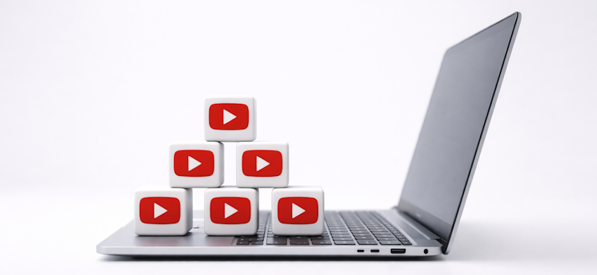 -video play button blocks on a laptop to show youtube audience strategy-
